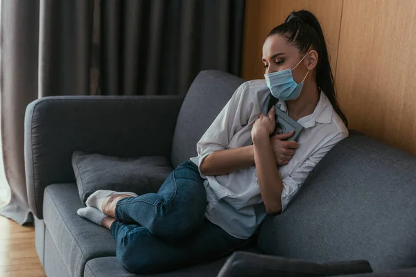 Stressed Young Woman Medical Mask Holding Photo Frame Chest While — Stock Photo, Image