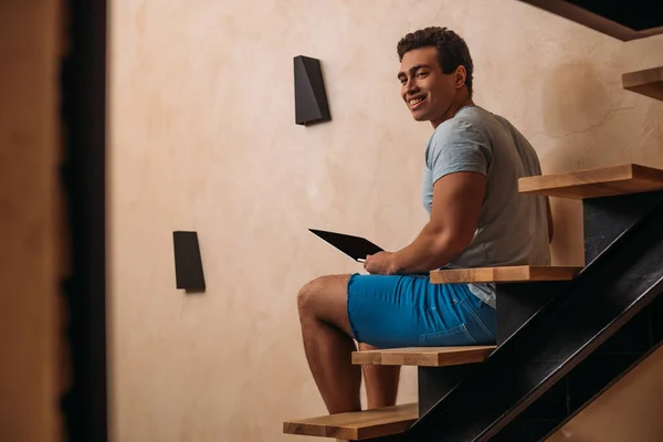Happy Mixed Race Man Using Laptop Stairs Home Quarantine — Stock Photo, Image