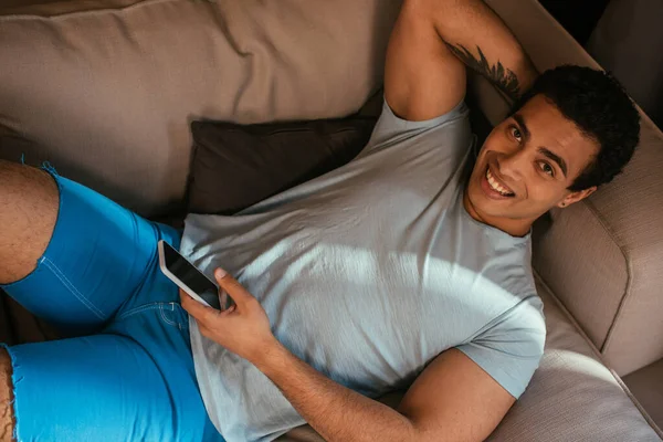 Top View Happy Mixed Race Man Chilling Using Smartphone Sofa — Stock Photo, Image