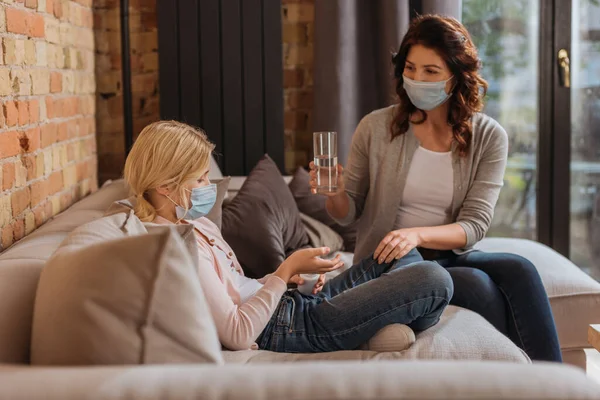 Selective Focus Mother Medical Mask Holding Glass Water Daughter Jar — Stock Photo, Image