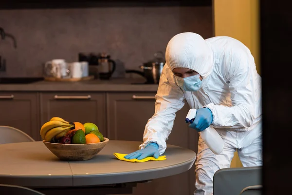 Selective Focus Man Hazmat Suit Medical Mask Cleaning Table Kitchen — Stock Photo, Image