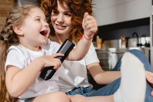 Selective Focus Cute Kid Holding Remote Controller Redhead Mother — Stock Photo, Image