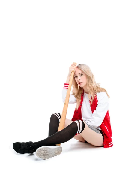 Woman sitting and holding baseball bat — Stock Photo