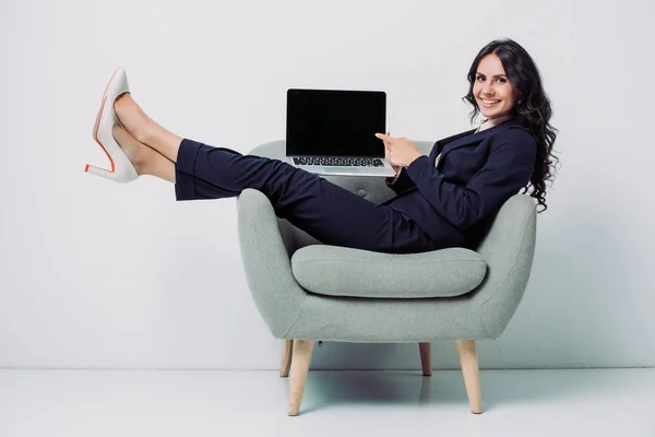 Businesswoman showing laptop — Stock Photo