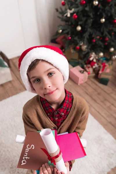 Boy with letters for santa — Stock Photo