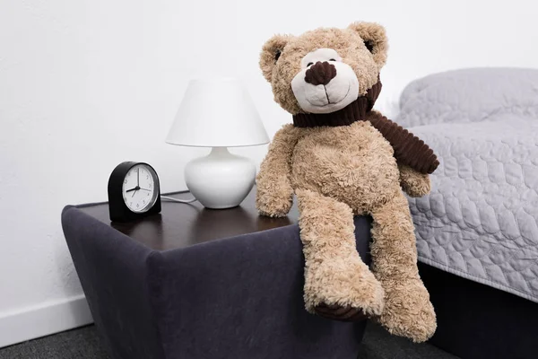 Teddy bear on nightstand — Stock Photo