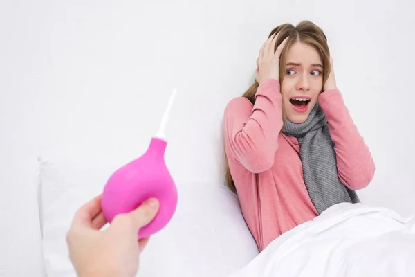 Woman frightened of enema — Stock Photo