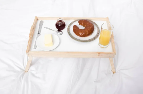 Wooden tray with breakfast — Stock Photo