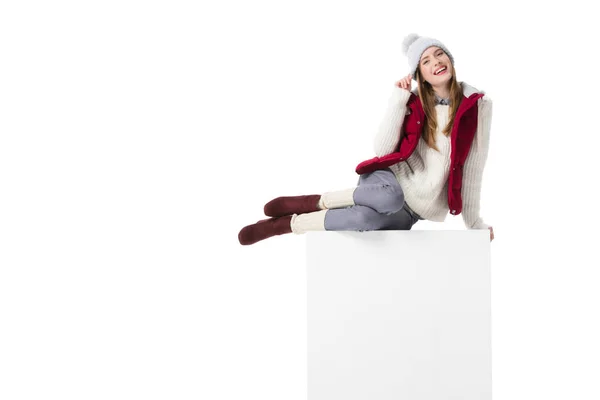 Sitting girl in knitted hat — Stock Photo