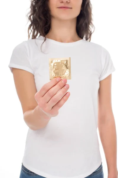 Woman holding condom — Stock Photo