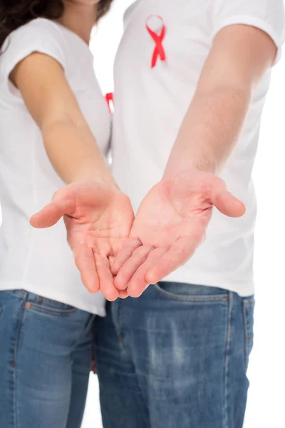 Couple in white t-shirts with aids ribbons — Stock Photo