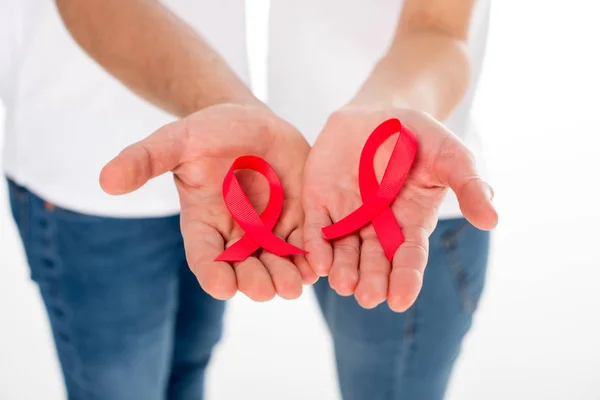 Couple with aids ribbons — Stock Photo
