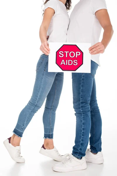 Pareja con cartel de stop aids - foto de stock