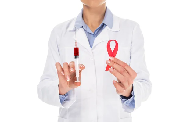 Doctor with aids ribbon and syringe — Stock Photo