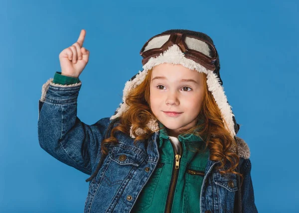 Portrait of adorable preteen kid in pilot costume isolated on blue — Stock Photo