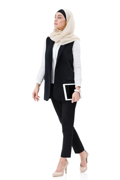 Stylish arabic businesswoman in hijab in digital tablet isolated on white — Stock Photo