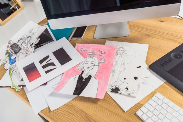 Work place of designer with drawings and computer — Stock Photo