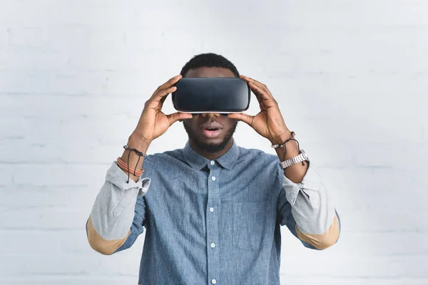 Handsome african american man wearing vr glasses — Stock Photo