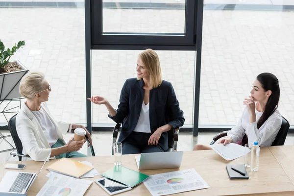 High angle view of beautiful businesswomen at meeting in office — Stock Photo