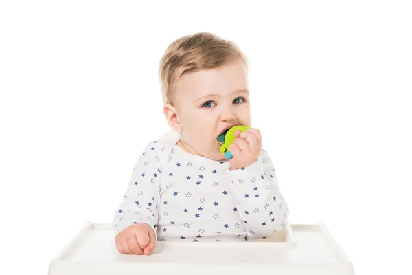 Adorable little boy with baby pacifier sitting in highchair isolated on white background — Stock Photo
