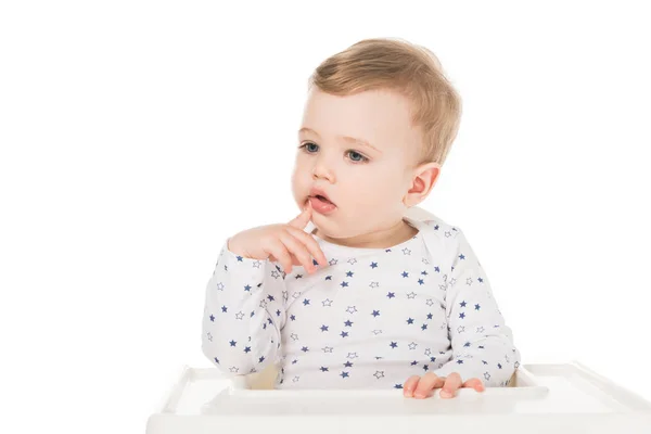 Little boy sitting in highchair isolated on white background — Stock Photo