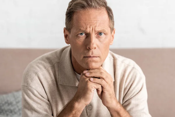 Sad senior man with alzheimer disease looking at camera — Stock Photo