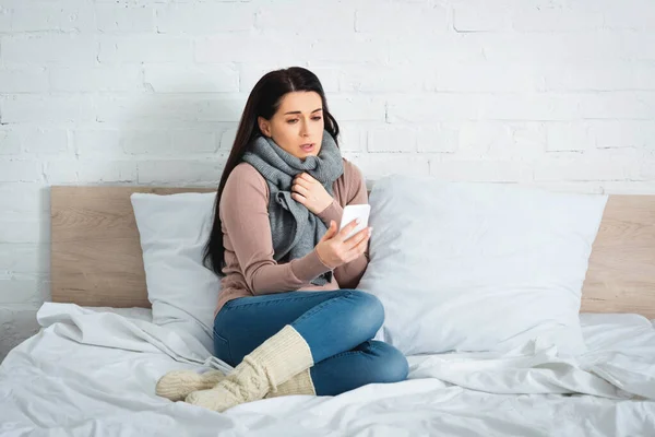 Sick patient having online consultation with doctor on smartphone — Stock Photo