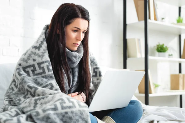 Tired ill woman having online consultation with doctor on laptop — Stock Photo