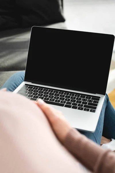 Cropped view of pregnant patient having online consultation with doctor on laptop with blank screen — Stock Photo