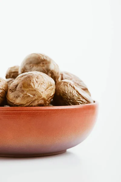 Delicious jacket potato in clay bowl on white background — Stock Photo