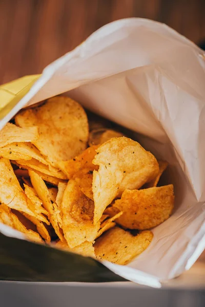 Close up view of delicious crispy potato chips in package — Stock Photo