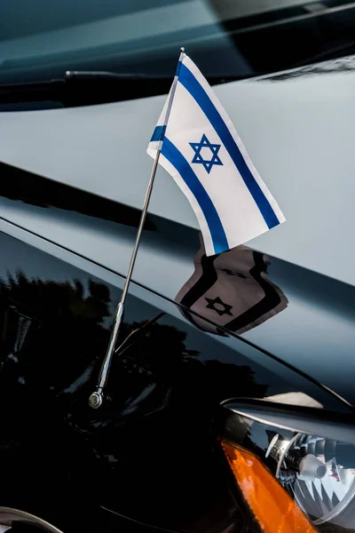 Close up of israel flag with star of david on black car — Stock Photo
