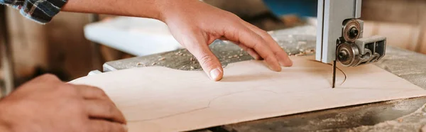 Panoramic shot of woodworker using cnc machine in workshop — Stock Photo