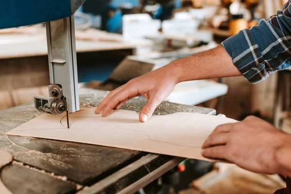 Cropped view of woodworker using cnc machine in workshop — Stock Photo