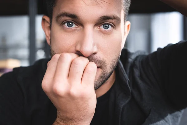 Handsome man with panic attack looking at camera in apartment — Stock Photo