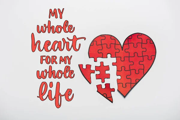 Top view of drawn red heart shape puzzles near my whole heart for my whole life letters on white — Stock Photo