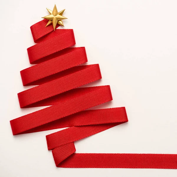 Top view of red decorative ribbon with star shape bow isolated on white — Stock Photo