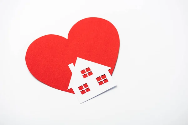 Red heart near paper house isolated on white — Stock Photo