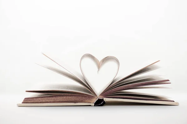 Book with heart-shaped pages on white with copy space — Stock Photo