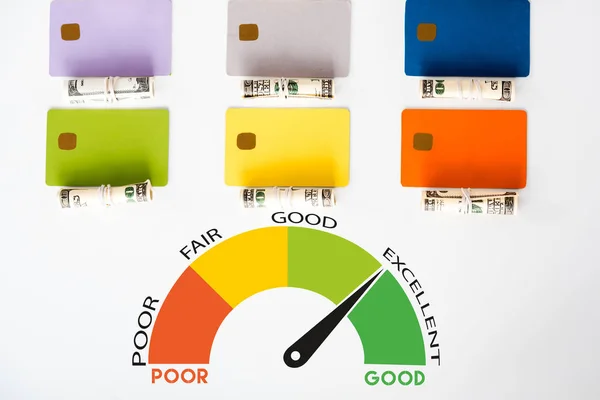 Top view of credit card templates near cash rolls with dollar banknotes and graph with letters isolated on white — Stock Photo