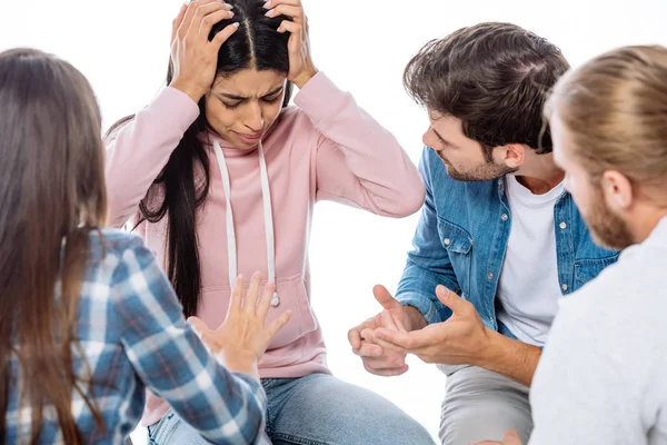 Support group helping worried african american girl on chair isolated on white — Stock Photo