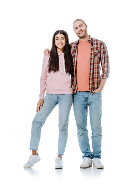 Full length view of happy young interracial couple embracing isolated on white — Stock Photo