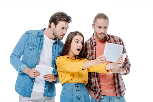 Shocked girl taking selfie on digital tablet near friends isolated on white — Stock Photo