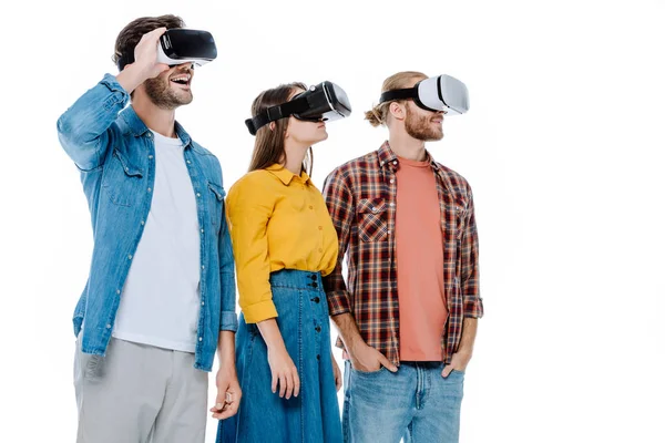 Excited three young friends in vr headsets isolated on white — Stock Photo