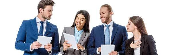 Multicultural business people in suits holding digital tablets isolated on white, panoramic shot — Stock Photo