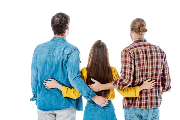 Vue arrière de trois jeunes amis étreignant isolé sur blanc — Photo de stock