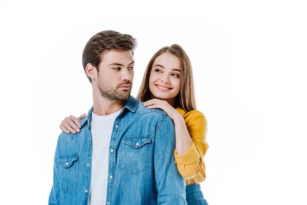 Smiling beautiful girl hugging boyfriend isolated on white — Stock Photo