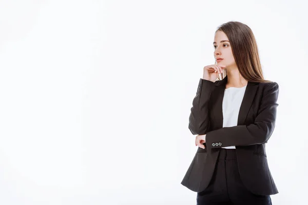 Pensativa mujer de negocios en traje mirando hacia otro lado aislado en blanco - foto de stock