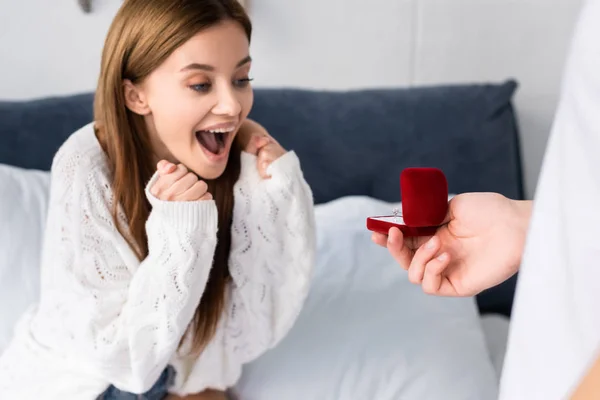 Cropped view of man doing marriage proposal to shocked woman — Stock Photo