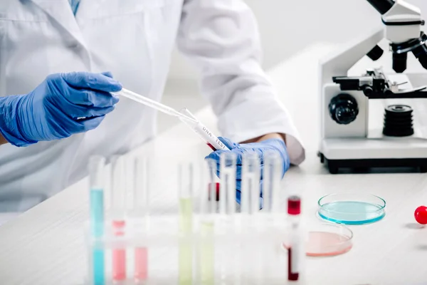 Cropped view of genetic consultant doing dna test in lab — Stock Photo